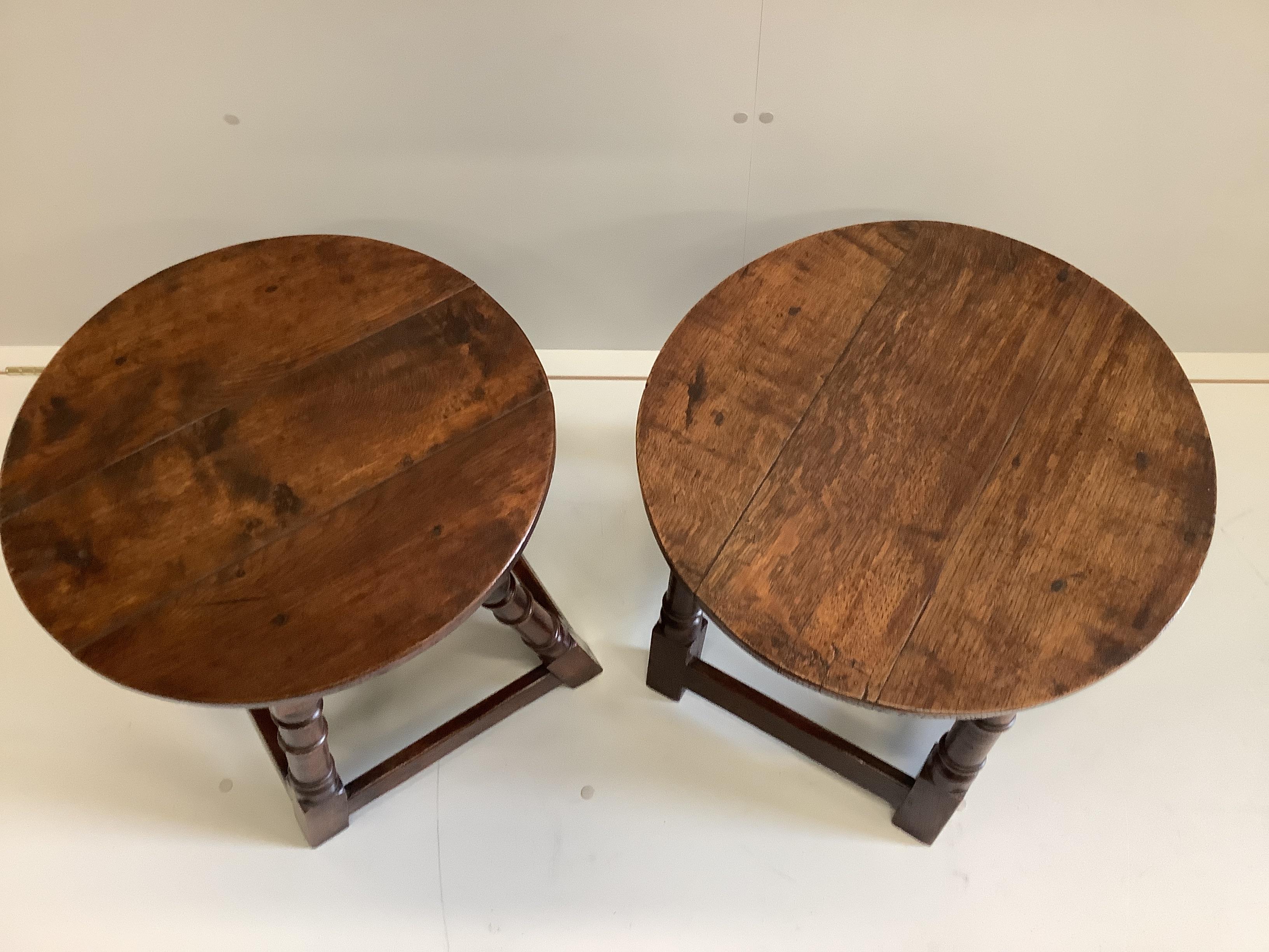 A near pair of early 20th century 18th century style circular oak occasional tables, 50cm diameter, height 48cm.